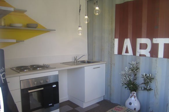 TOP DESIGN? SHIPPING CONTAINER ARCHITECTURE MEETS A REALITY TV SHOW