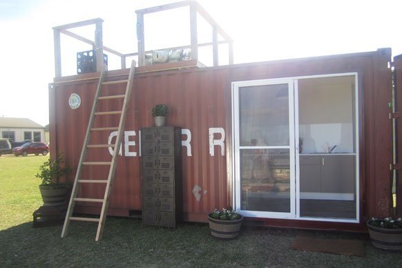 TOP DESIGN? SHIPPING CONTAINER ARCHITECTURE MEETS A REALITY TV SHOW