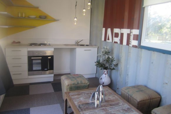 TOP DESIGN? SHIPPING CONTAINER ARCHITECTURE MEETS A REALITY TV SHOW