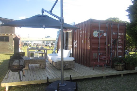 TOP DESIGN? SHIPPING CONTAINER ARCHITECTURE MEETS A REALITY TV SHOW